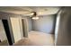 Bedroom with carpeted floor, ceiling fan, and closet at 497 Prince Of Wales, Stone Mountain, GA 30083