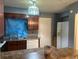 Functional kitchen featuring wooden cabinets, neutral countertops, and essential appliances at 497 Prince Of Wales, Stone Mountain, GA 30083