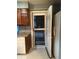 Kitchen area featuring cabinetry, marble counters, and exit to deck at 497 Prince Of Wales, Stone Mountain, GA 30083