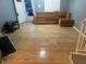 Cozy living room featuring hardwood floors and a comfortable couch at 497 Prince Of Wales, Stone Mountain, GA 30083