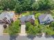 Aerial view of a neighborhood with mature trees and well-manicured lawns showcasing this community's attractive curb appeal at 530 Summerhill Dr, Roswell, GA 30075
