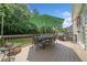 Expansive wooden deck featuring a dining table, chairs, grill, and lush backyard at 530 Summerhill Dr, Roswell, GA 30075