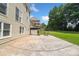 This backyard features a stone patio with a sports area and is perfect for outdoor entertaining and recreation at 530 Summerhill Dr, Roswell, GA 30075