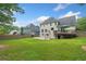 Expansive backyard with deck, basketball court, fence and lawn at 530 Summerhill Dr, Roswell, GA 30075