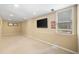 Basement area with TV, sign, window, and carpet at 530 Summerhill Dr, Roswell, GA 30075