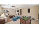 Finished basement featuring a foosball table, exercise equipment, and comfortable seating at 530 Summerhill Dr, Roswell, GA 30075