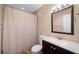 Bathroom with shower, toilet, vanity, and dark wood cabinets at 530 Summerhill Dr, Roswell, GA 30075