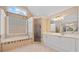 Bright bathroom boasts a glass walk-in shower, soaking tub, and double sink vanity with lots of counter space at 530 Summerhill Dr, Roswell, GA 30075