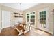 Dining area with hardwood floors, chandelier, and access to outdoor deck at 530 Summerhill Dr, Roswell, GA 30075