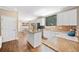 Open kitchen featuring an island with granite countertops and stainless steel appliances at 530 Summerhill Dr, Roswell, GA 30075