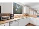Kitchen featuring stainless steel appliances and a large window with a view at 530 Summerhill Dr, Roswell, GA 30075