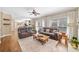 Spacious living room featuring hardwood floors and two reclining sofas at 530 Summerhill Dr, Roswell, GA 30075