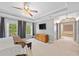 This main bedroom features an adjoining bathroom and tray ceiling with large windows for lots of natural light at 530 Summerhill Dr, Roswell, GA 30075