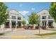 Outdoor dining at Lily Sushi Bar and The Nest Cafe surrounded by decorative trees and brick buildings at 530 Summerhill Dr, Roswell, GA 30075