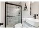 Bathroom with modern fixtures, white vanity, and glass shower doors at 1126 Mainstreet Valley Dr, Stone Mountain, GA 30088