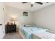 Cozy bedroom with light gray walls, carpet, and a ceiling fan at 1126 Mainstreet Valley Dr, Stone Mountain, GA 30088