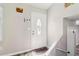 Bright entryway featuring a decorative front door, neutral paint, and updated flooring at 1126 Mainstreet Valley Dr, Stone Mountain, GA 30088
