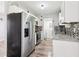 Well-lit kitchen with stainless steel appliances, granite countertops, and neutral cabinets at 1126 Mainstreet Valley Dr, Stone Mountain, GA 30088