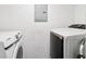 Modern laundry room featuring a front-load washer and dryer at 1126 Mainstreet Valley Dr, Stone Mountain, GA 30088