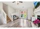 Bright living room with wood floors, fireplace, and access to the backyard through French doors at 1126 Mainstreet Valley Dr, Stone Mountain, GA 30088