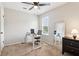 Home office with neutral carpet and a large mirror reflecting a desk at 1126 Mainstreet Valley Dr, Stone Mountain, GA 30088