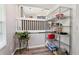 Walk-in pantry featuring wire shelving and wood-look flooring at 1126 Mainstreet Valley Dr, Stone Mountain, GA 30088