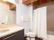 Bathroom with a toilet, shower with white curtain, and vanity with sink at 170 Boulevard Se # E117, Atlanta, GA 30312