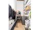 Efficient laundry area features a washer, shelving, storage and hanging space for convenience and organization at 170 Boulevard Se # E117, Atlanta, GA 30312