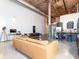 Comfortable living room featuring a spiral staircase, exposed beams, and an open layout at 170 Boulevard Se # E117, Atlanta, GA 30312