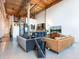 Open living space with a modern kitchen, exposed beams, and large windows, providing ample natural light at 170 Boulevard Se # E117, Atlanta, GA 30312