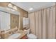 Bathroom featuring a granite vanity, updated lighting, and neutral color palette at 1705 Brighton Pt, Atlanta, GA 30328