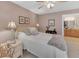 Cozy bedroom with a bed, lamps, artwork, and an adjoining bathroom at 1705 Brighton Pt, Atlanta, GA 30328