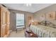 Comfortable bedroom with neutral colors and bright natural light at 1705 Brighton Pt, Atlanta, GA 30328