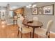 Charming dining area with hardwood floors, chandelier, and kitchen access at 1705 Brighton Pt, Atlanta, GA 30328
