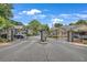 Gated community entrance with brick pillars and wrought iron at 1705 Brighton Pt, Atlanta, GA 30328