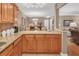 Well-equipped kitchen featuring granite countertops, ample cabinetry, and hardwood floors at 1705 Brighton Pt, Atlanta, GA 30328