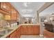 Well-lit kitchen with granite countertops and stainless steel sink overlooking the living room at 1705 Brighton Pt, Atlanta, GA 30328