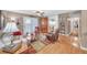 Comfortable living room with ceiling fan, neutral walls, and access to outdoor patio at 1705 Brighton Pt, Atlanta, GA 30328