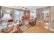 Cozy living room features hardwood floors, French doors, and a ceiling fan at 1705 Brighton Pt, Atlanta, GA 30328
