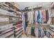 Organized walk-in closet with shelves, hanging racks, and ample storage space at 1705 Brighton Pt, Atlanta, GA 30328