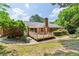 This home has a spacious backyard with a wood deck and mature trees at 3292 Ferncliff Ne Pl, Atlanta, GA 30324