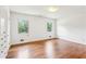 A bedroom features hardwood floors, neutral paint, and natural light at 3292 Ferncliff Ne Pl, Atlanta, GA 30324