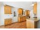 Eat-in kitchen with granite counters, wood cabinetry, and hardwood floors at 3292 Ferncliff Ne Pl, Atlanta, GA 30324