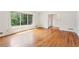 Bright living room featuring wood floors, fresh paint, and large windows overlooking a private backyard at 3292 Ferncliff Ne Pl, Atlanta, GA 30324