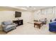 Cozy finished basement featuring comfortable seating, a TV and an open layout at 3292 Ferncliff Ne Pl, Atlanta, GA 30324