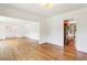 Open-concept living space with hardwood floors seamlessly connecting to the kitchen at 3292 Ferncliff Ne Pl, Atlanta, GA 30324