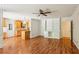 A bright living room features hardwood floors, custom built-ins, and an open floor plan to the eat-in kitchen at 3292 Ferncliff Ne Pl, Atlanta, GA 30324