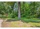 This beautiful home features a lush backyard with mature trees and garden at 3292 Ferncliff Ne Pl, Atlanta, GA 30324