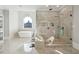 Luxurious bathroom featuring a modern shower, soaking tub, and elegant finishes at 3423 Jamont Blvd, Alpharetta, GA 30022