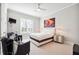 Bedroom with a queen-sized bed, neutral decor, and an art-adorned accent wall at 3423 Jamont Blvd, Alpharetta, GA 30022